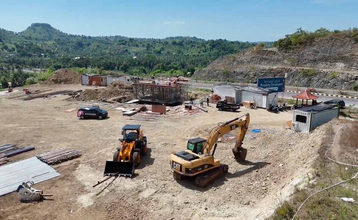 Main Sekotong site overview with excavator and bulldozer following land clearing, May 2026