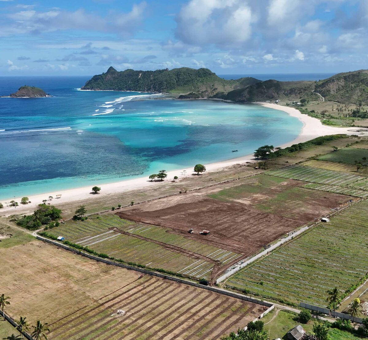 Aerial view of Pengantap Beach in Sekotong with the cleared Saraya site fronting the bay